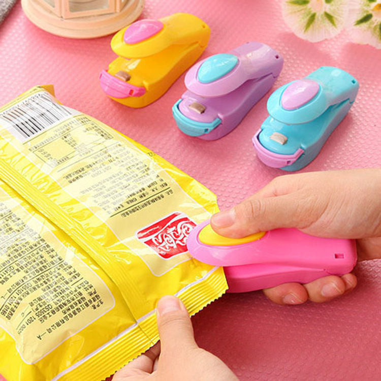 Candy color portable mini sealing machine snack plastic bag sealing machine household small hand pressure heat sealing machine wholesale